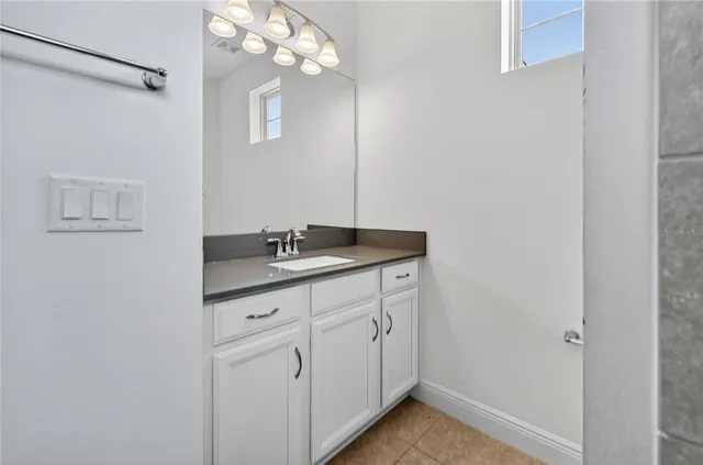 a white toilet sitting next to a bathtub