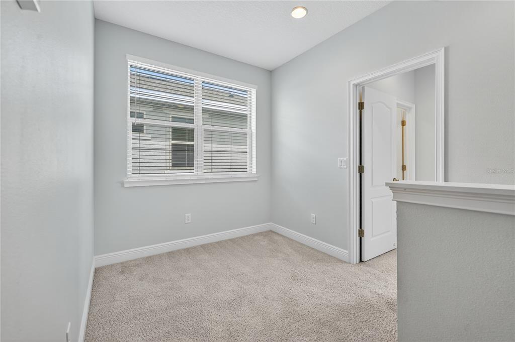 6687 Alder Road Harmony, FL 34773 - Photo 39 of 42 an empty room with a window