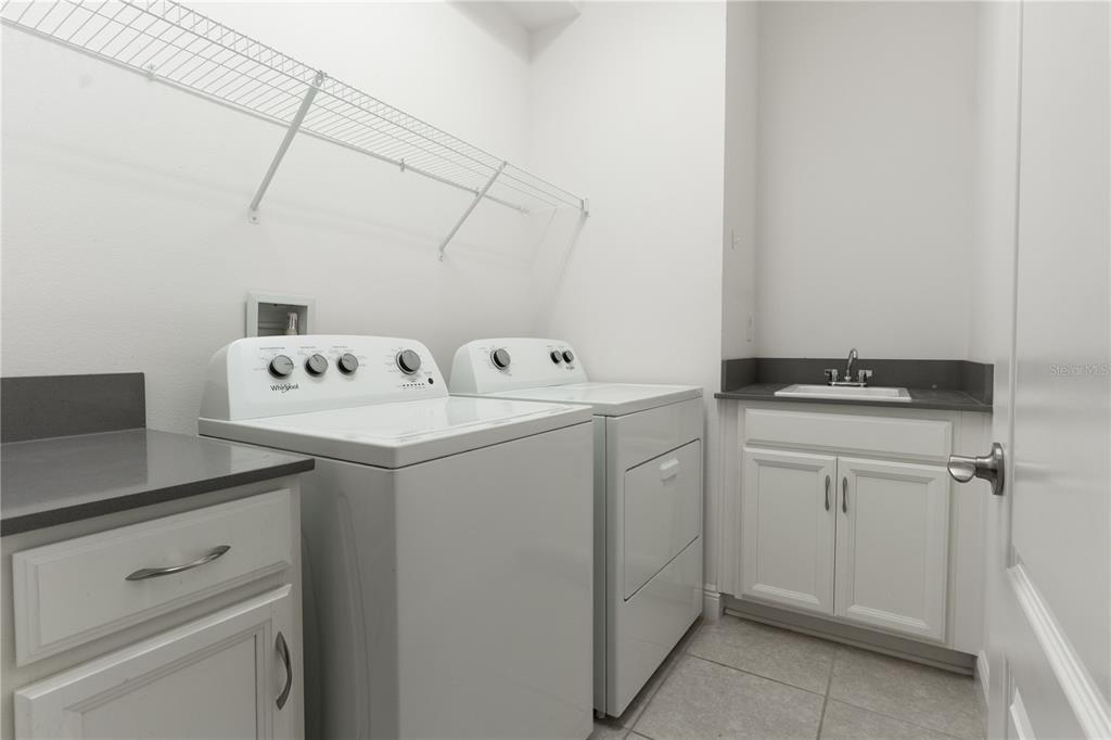 6687 Alder Road Harmony, FL 34773 - Photo 40 of 42 a utility room with dryer and washer