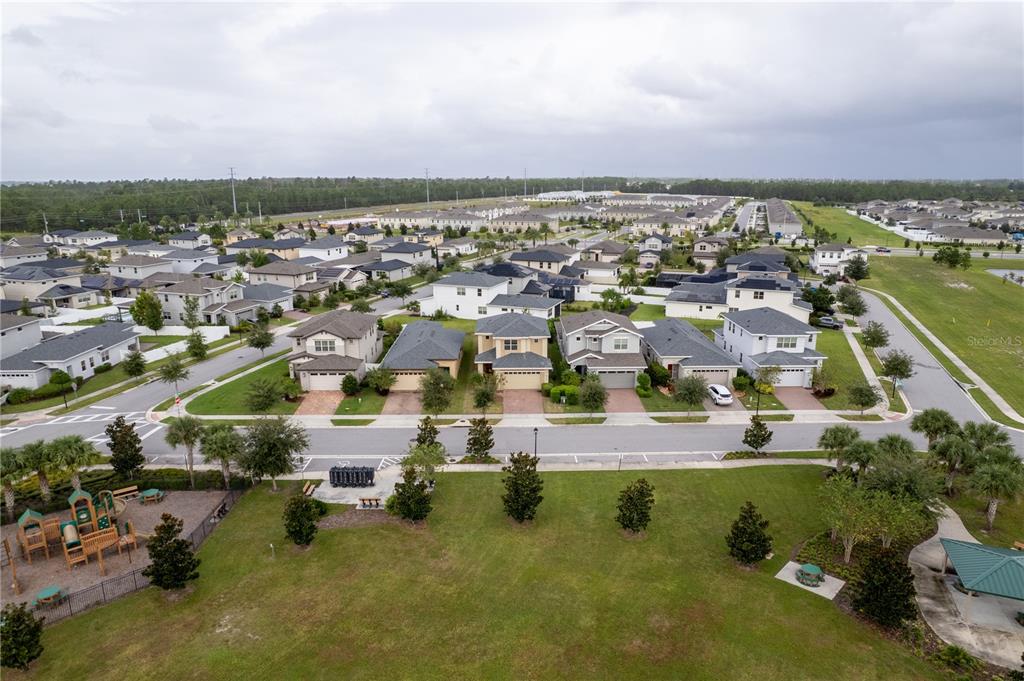 6687 Alder Road Harmony, FL 34773 - Photo 5 of 42 an aerial view of residential houses with outdoor space