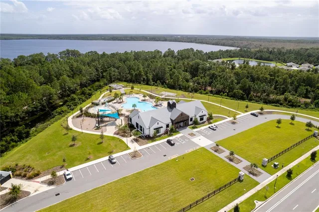 an aerial view of a house with a swimming pool