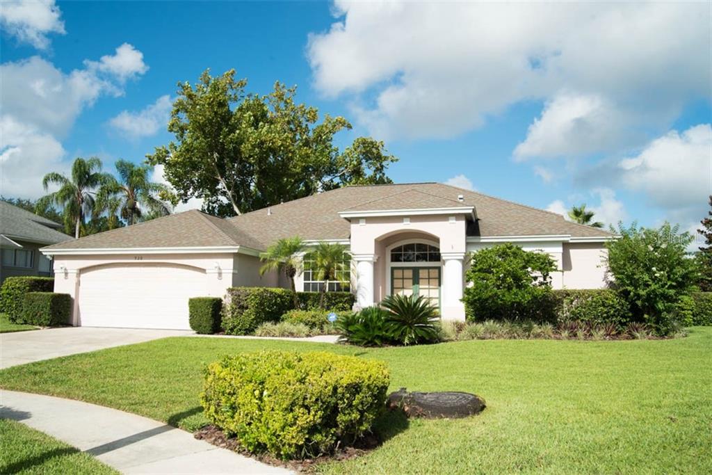 920 Ridge Spring Court Apopka, FL 32712 - Photo 1 of 1 a front view of a house with a yard