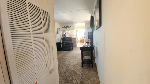 a view of workspace with furniture and window