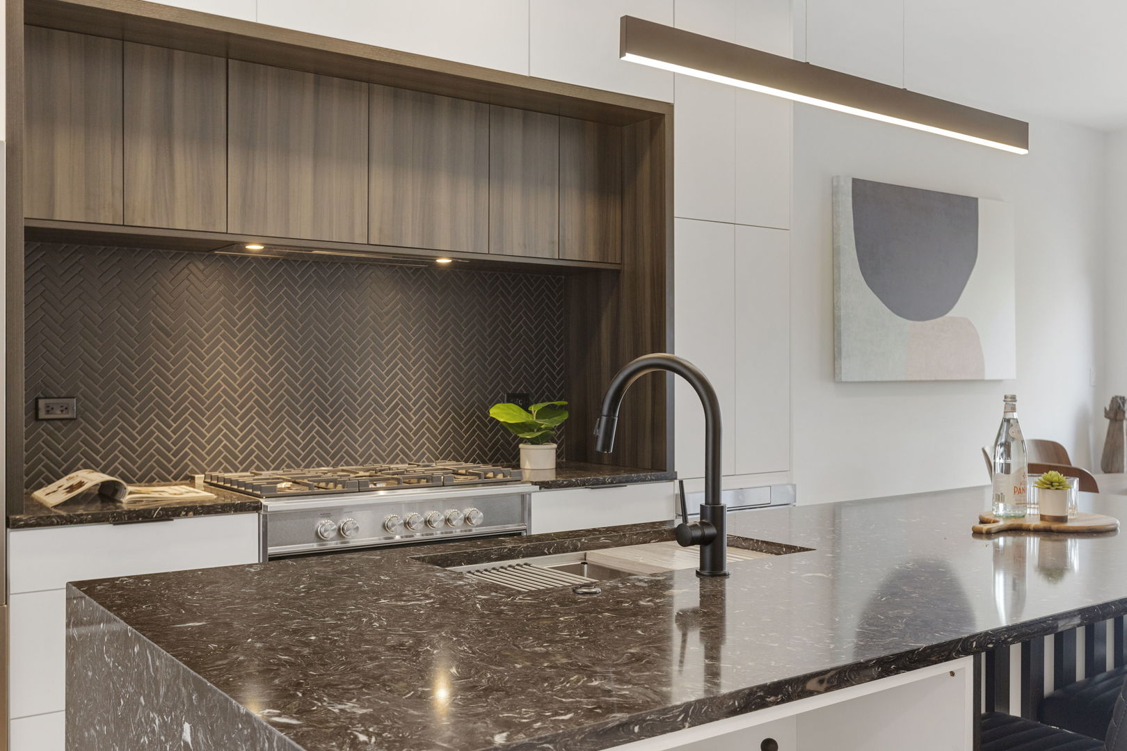 338 East Pershing Road Chicago, IL 60653 - Photo 14 of 86 a kitchen with granite countertop a sink a stove and cabinets