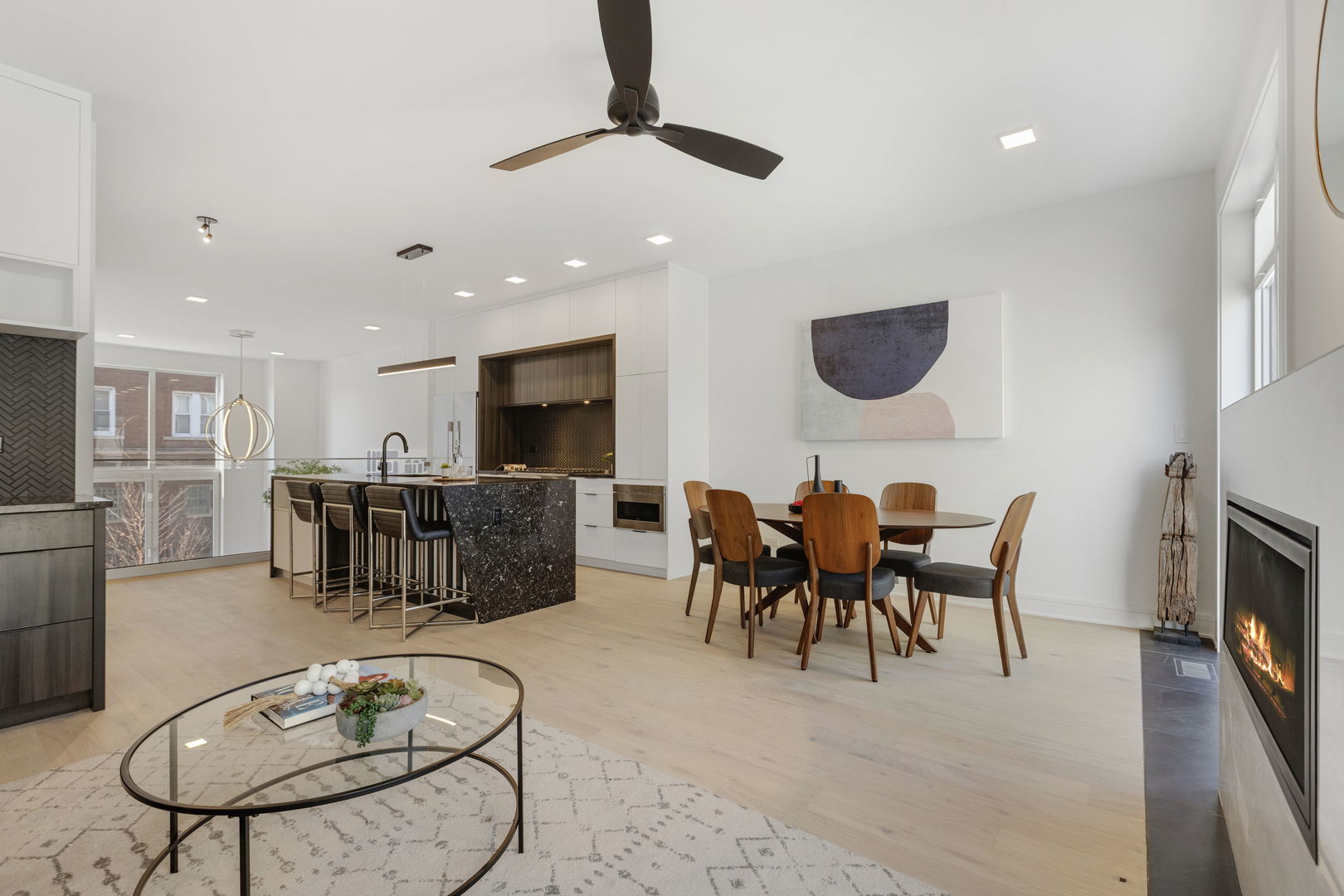 338 East Pershing Road Chicago, IL 60653 - Photo 31 of 86 a living room with furniture a dining table and kitchen view