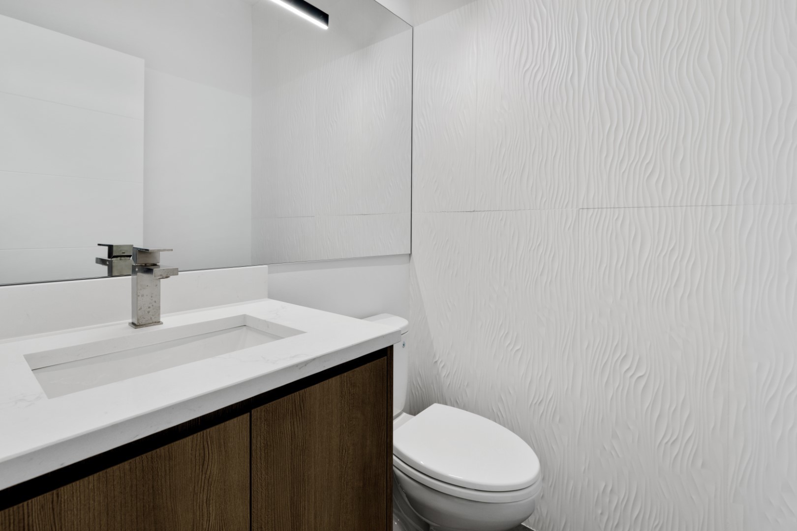 338 East Pershing Road Chicago, IL 60653 - Photo 34 of 86 a bathroom with a sink a toilet and mirror