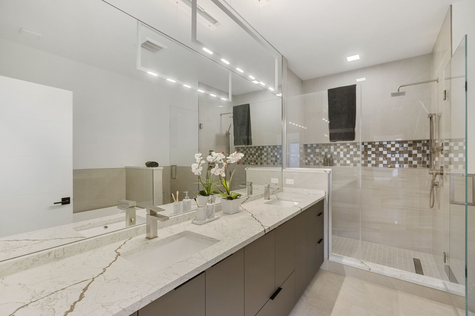 338 East Pershing Road Chicago, IL 60653 - Photo 42 of 86 a bathroom with double vanity sinks and a shower