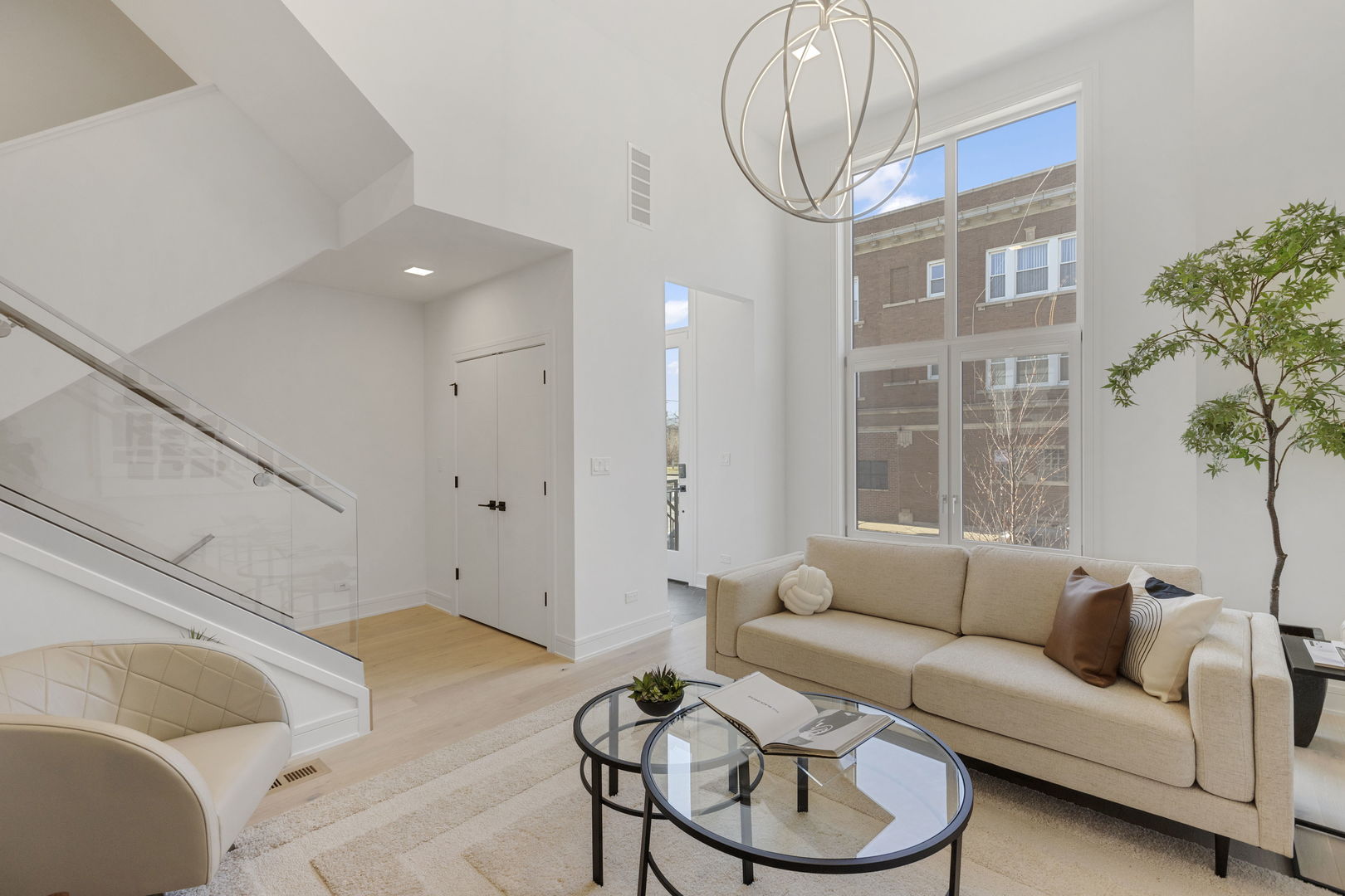 338 East Pershing Road Chicago, IL 60653 - Photo 8 of 86 a living room with furniture a table and a chandelier