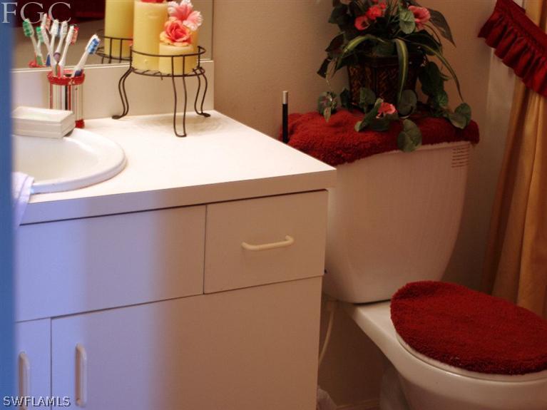 213 Rue Labonne Road Fort Myers, FL 33913 - Photo 6 of 8 a bathroom with a sink and toilet