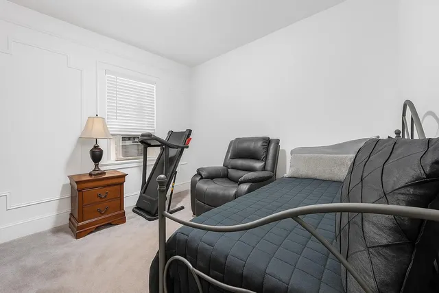 a view of a room with furniture and windows