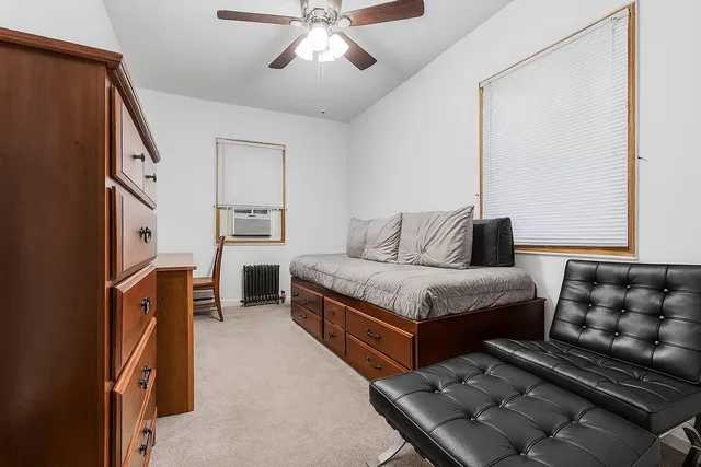 a bedroom with furniture and window
