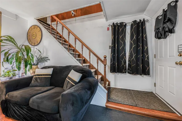 a living room with furniture and a rug