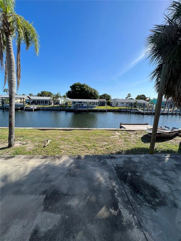1037 Apollo Beach Boulevard, Unit D Apollo Beach, FL 33572 - Photo 1 of 42 a view of a lake with houses in the back