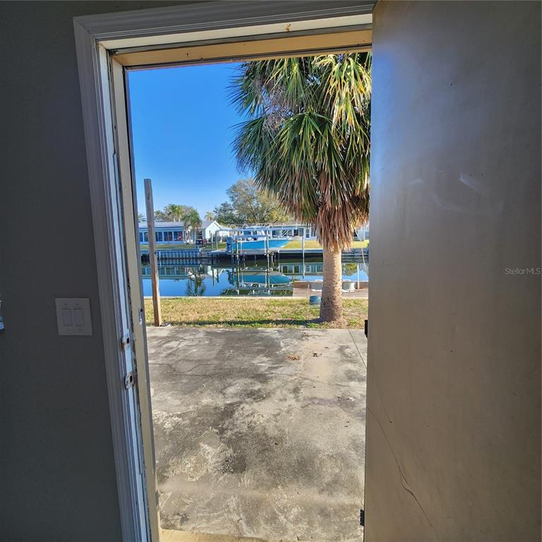 1037 Apollo Beach Boulevard, Unit D Apollo Beach, FL 33572 - Photo 15 of 42 a view of entryway with a palm tree