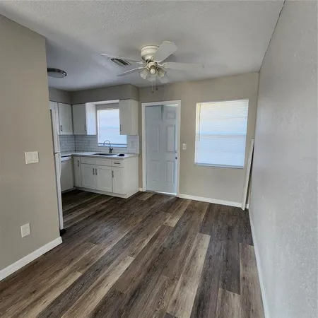 a view of a livingroom with an empty space and a sink
