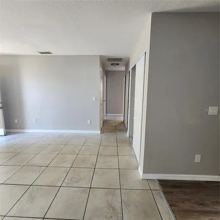 a view of workspace with furniture and window
