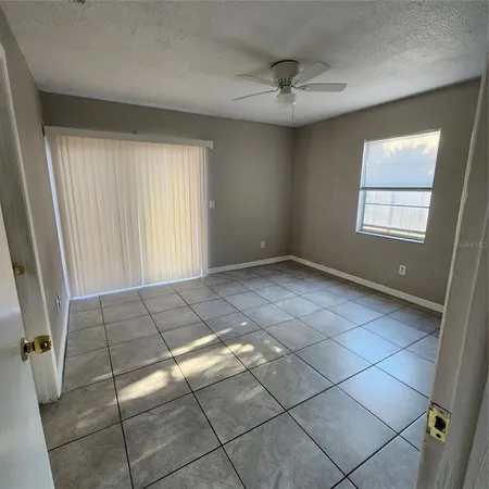 a view of an empty room with a window