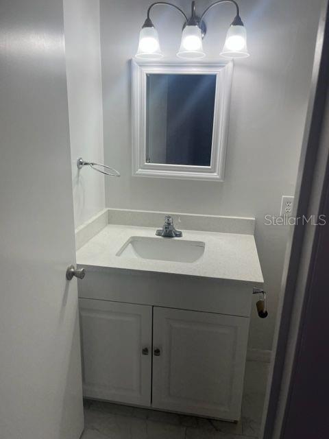 1037 Apollo Beach Boulevard, Unit D Apollo Beach, FL 33572 - Photo 34 of 42 a bathroom with a sink and a mirror