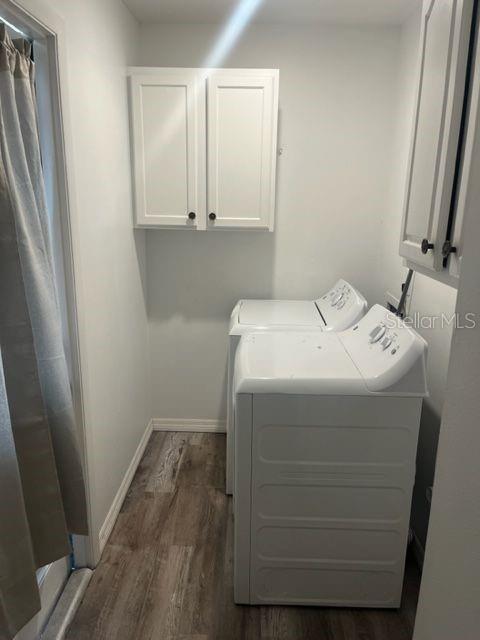 1037 Apollo Beach Boulevard, Unit D Apollo Beach, FL 33572 - Photo 39 of 42 a utility room with wooden floor washer and dryer