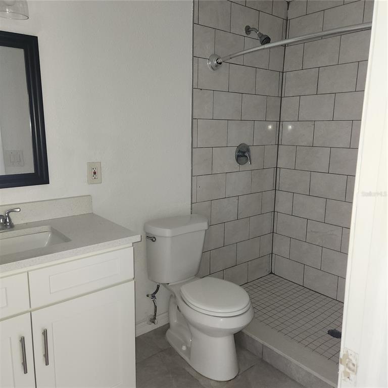 1037 Apollo Beach Boulevard, Unit D Apollo Beach, FL 33572 - Photo 5 of 42 a bathroom with a sink a toilet and shower