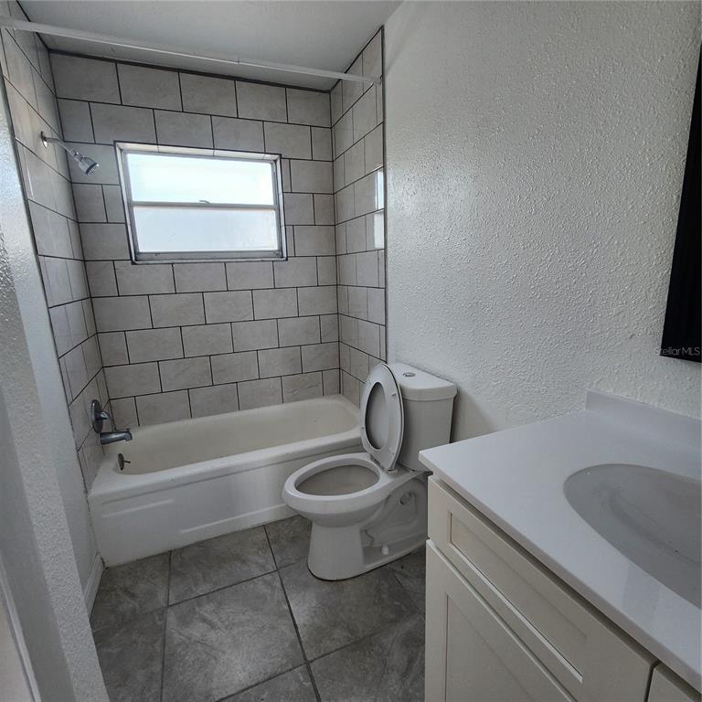 1037 Apollo Beach Boulevard, Unit D Apollo Beach, FL 33572 - Photo 10 of 42 a bathroom with a sink a toilet and bathtub