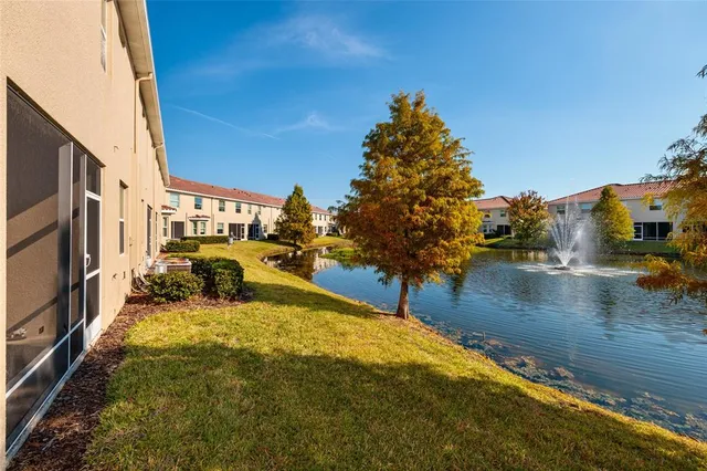 a swimming pool with outdoor seating and yard