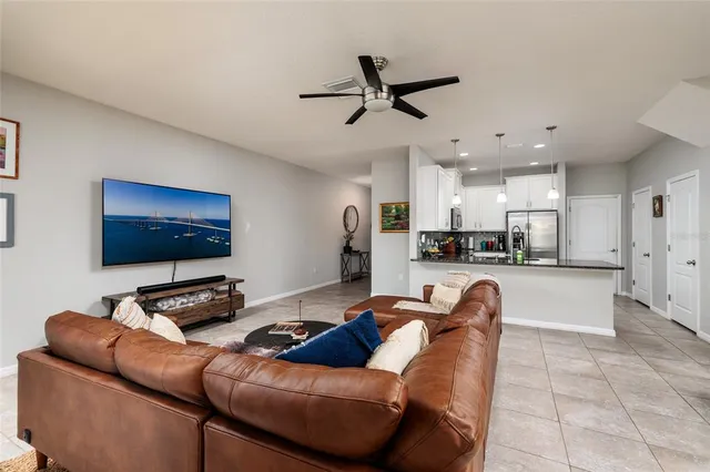 a kitchen with sink refrigerator and cabinets