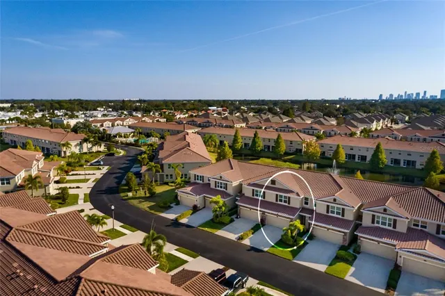 an aerial view of residential houses with outdoor space