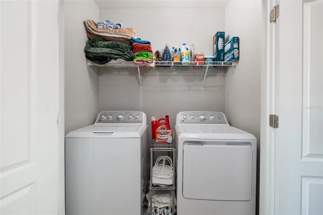 an aerial view of a house with a garden and lake view