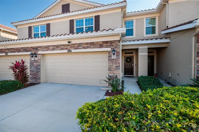 a living room with lots of furniture and a chandelier