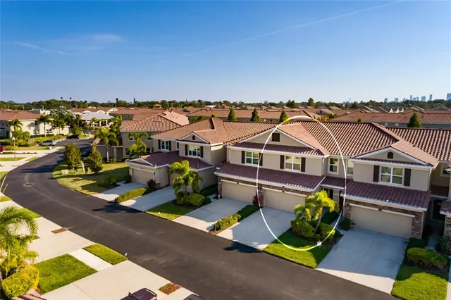 a living room with furniture a large window and a fireplace