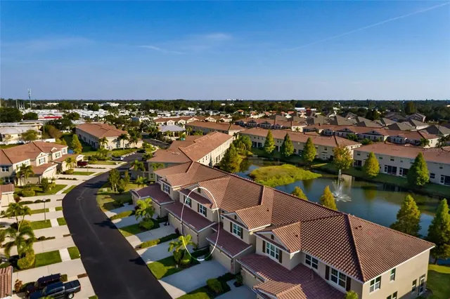 an aerial view of residential houses with outdoor space