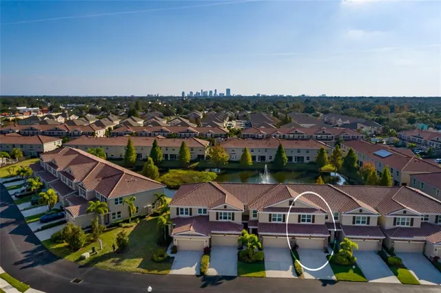 an aerial view of residential houses and city street