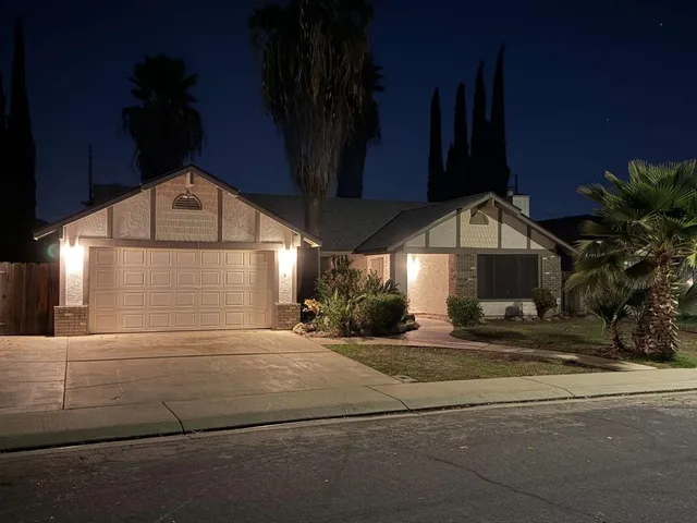 a view of a building with car parked