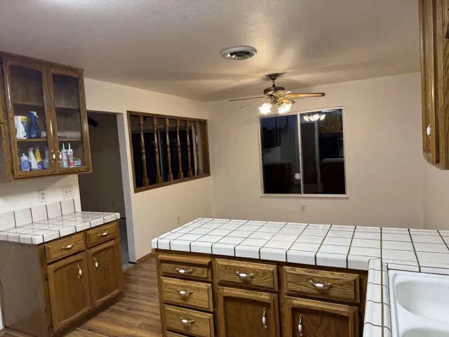 a bathroom with a sink vanity and mirror
