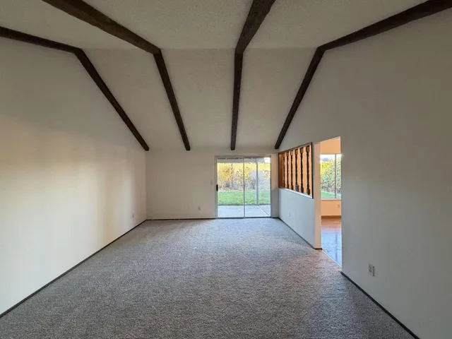 a view of empty room with floor to ceiling window