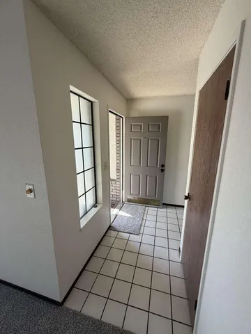 a view of an empty room and windows