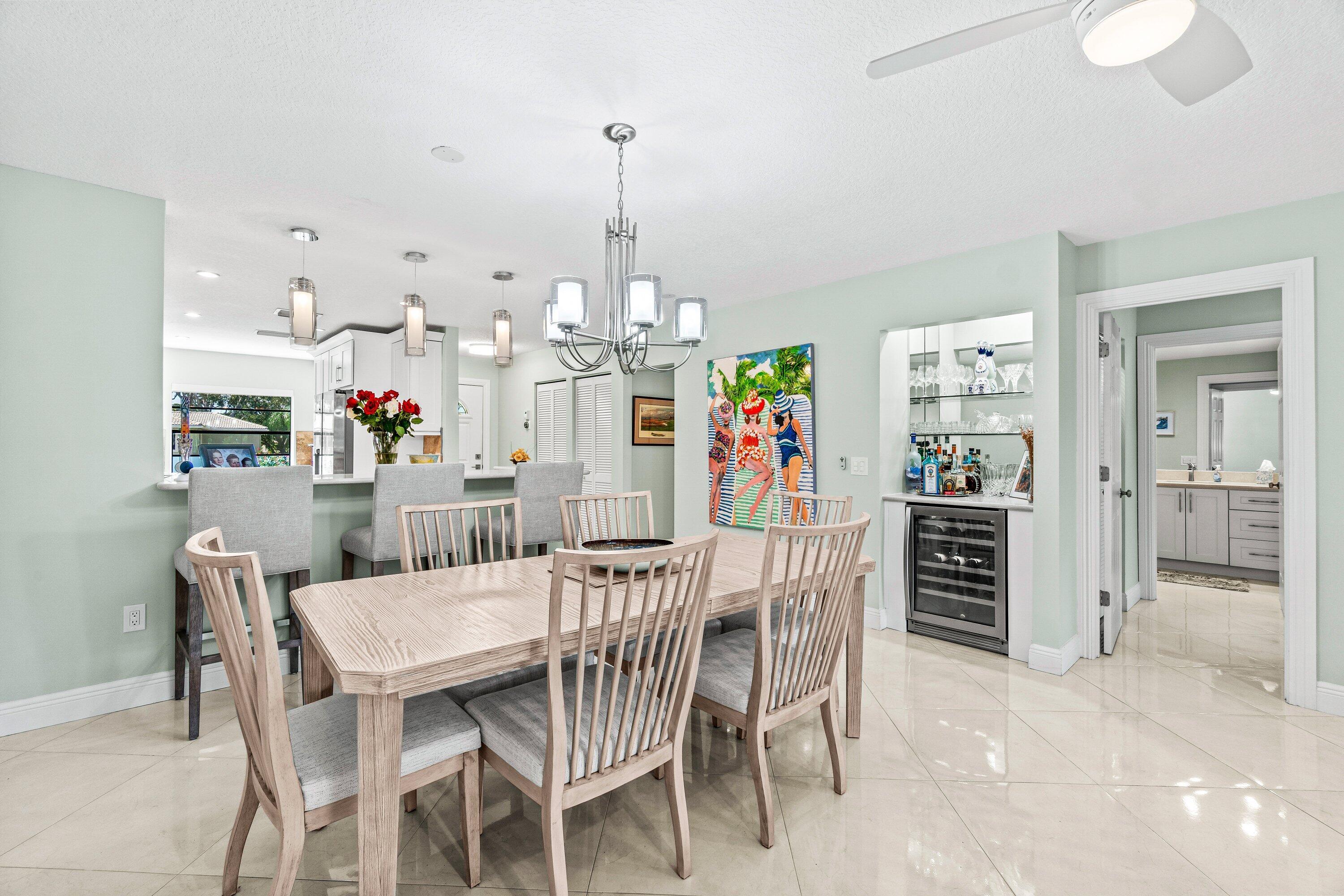 24 Stratford Drive East, Unit D Boynton Beach, FL 33436 - Photo 12 of 52 a view of a dining room and furniture