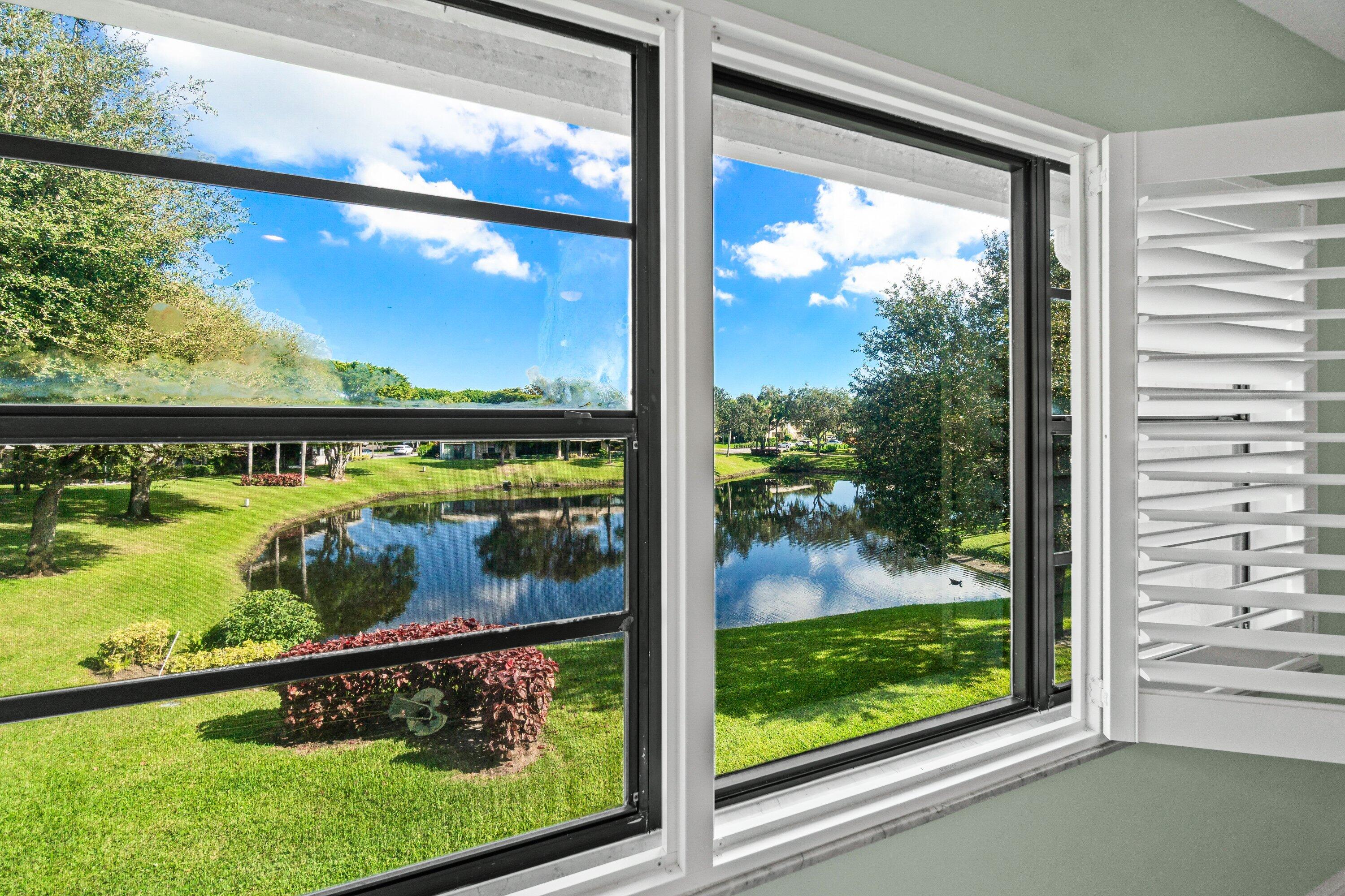 24 Stratford Drive East, Unit D Boynton Beach, FL 33436 - Photo 19 of 52 a view of a from a window
