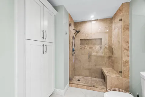 a view of a kitchen cabinets and a stove