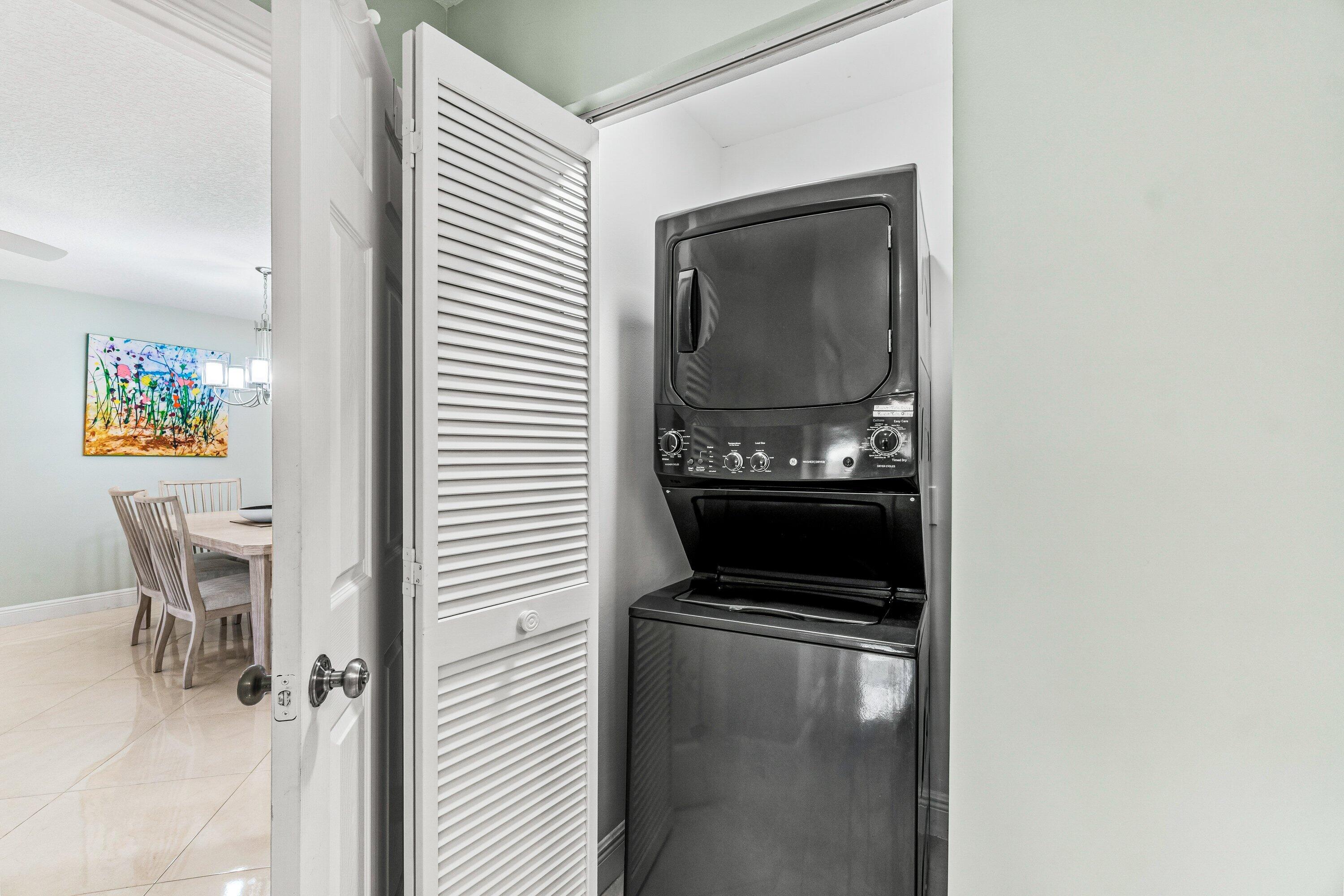 24 Stratford Drive East, Unit D Boynton Beach, FL 33436 - Photo 22 of 52 a view of a kitchen cabinets and a stove