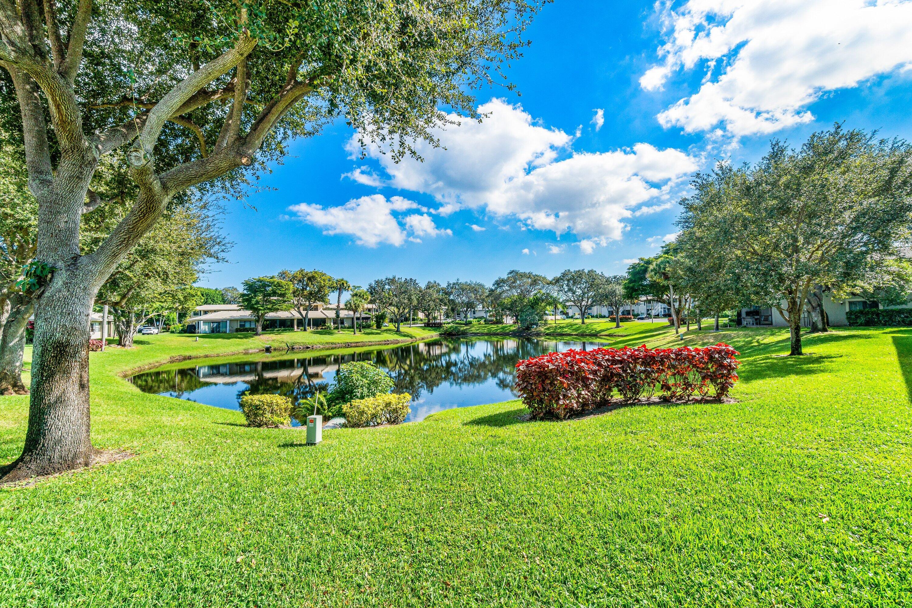 24 Stratford Drive East, Unit D Boynton Beach, FL 33436 - Photo 27 of 52 a view of an outdoor space and yard