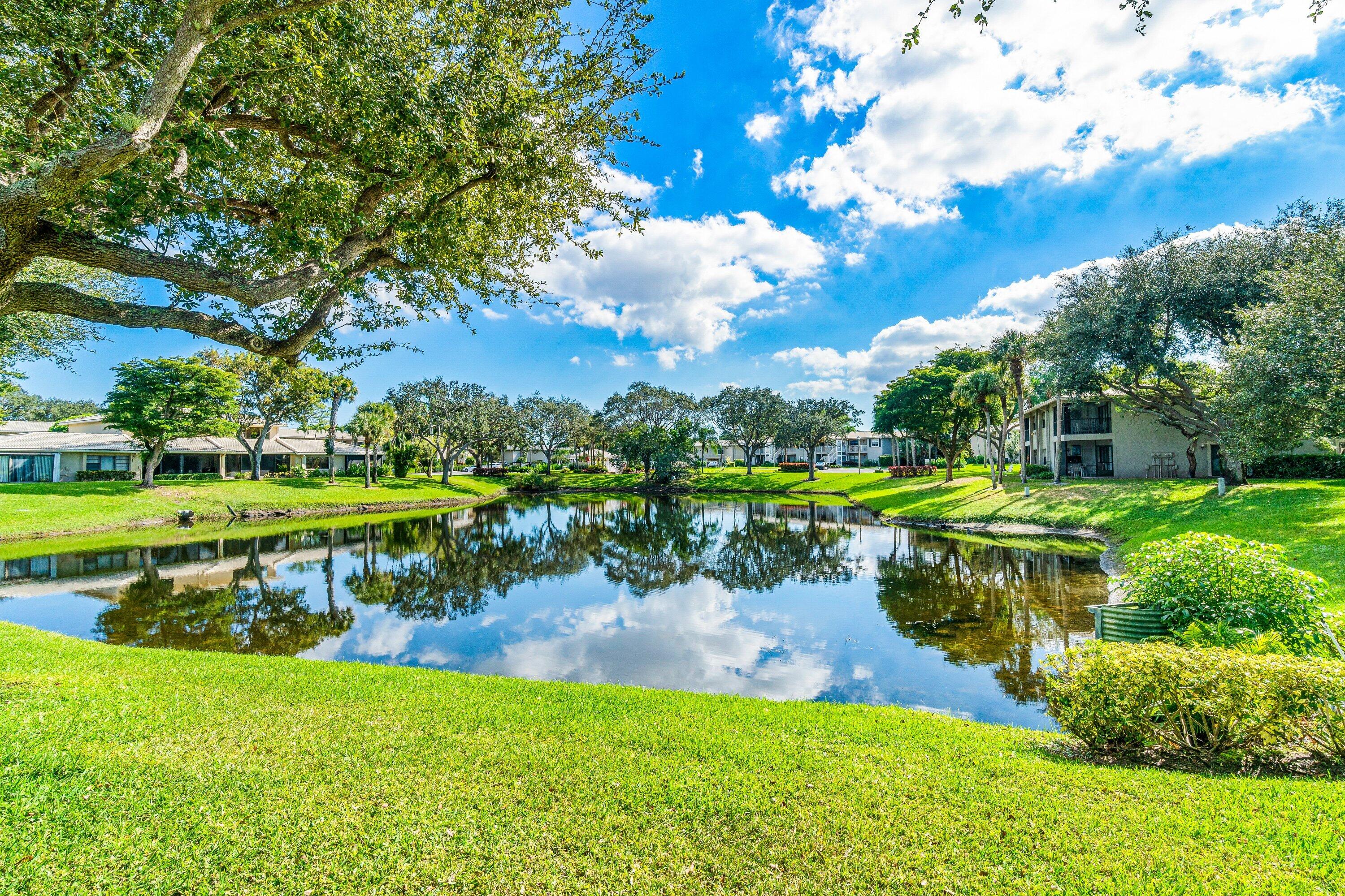 24 Stratford Drive East, Unit D Boynton Beach, FL 33436 - Photo 28 of 52 a view of a swimming pool with a yard