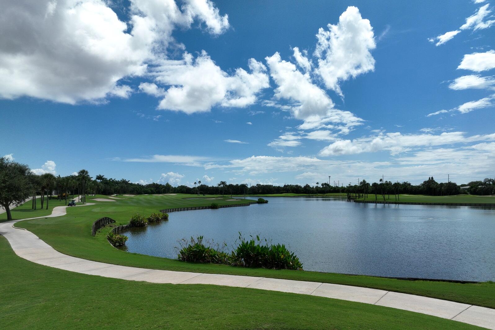 24 Stratford Drive East, Unit D Boynton Beach, FL 33436 - Photo 45 of 52 a view of a lake with houses in the back