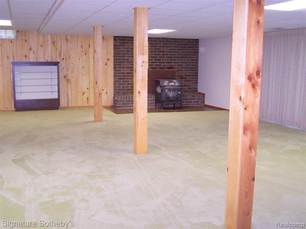247 Old Perch Road Rochester, MI 48309 - Photo 15 of 22 HUGE REC ROOM/WOOD STOVE