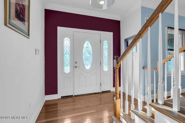 a living room with furniture and a view of kitchen