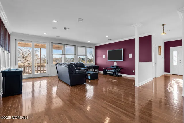 a kitchen with stainless steel appliances granite countertop wooden floors sink and cabinets