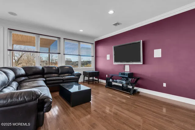 a large kitchen with granite countertop a large counter top stainless steel appliances and cabinets