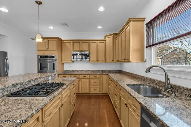 a living room with furniture and a ceiling fan