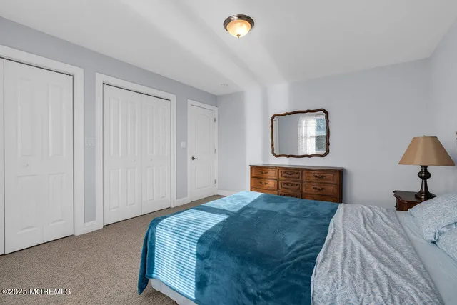 a view of a small space with wooden floor and a window